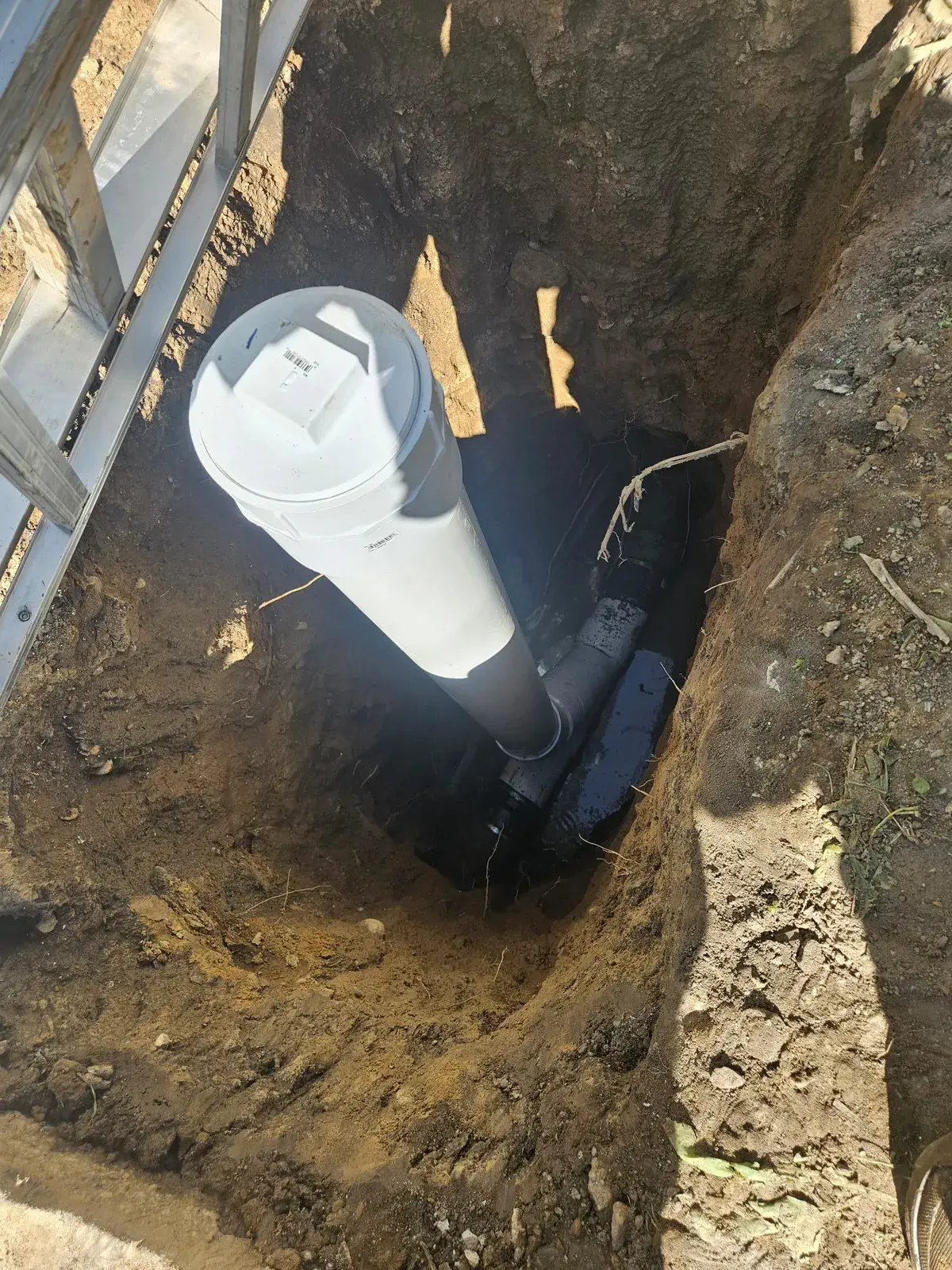 New sewer cleanout riser installed in an open excavation